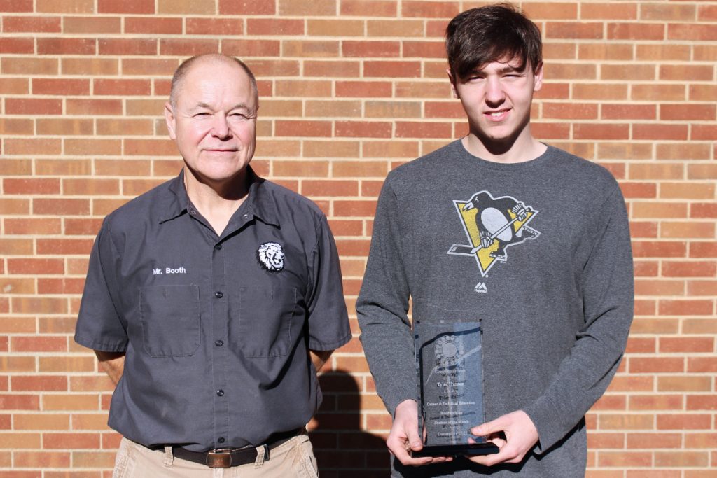 Pictured from left: Mill Works teacher Eric Booth and CTE Student of the Month Tyler Hunter.