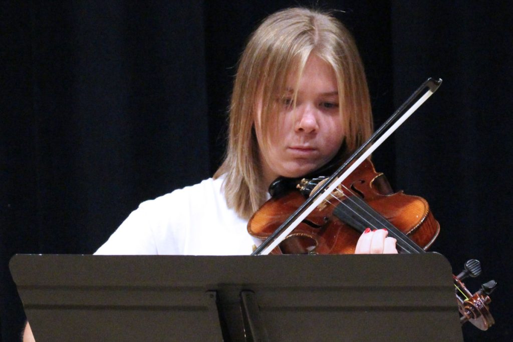 John Marshall High School Strings student Sofiah Bozenske plays one of the violins from the Violins of Hope collection.