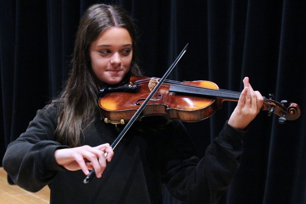 Alina Holliday, a John Marshall High School sophomore in the String program, was permitted to play one of the restored violins that was played by concentration camp prisoners during the Holocaust.