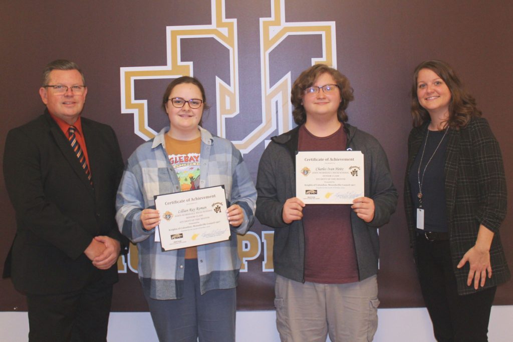 Pictured from left: K of C Council 1907 Grand Knight Lou Richmond, Lillian Roman, Charles Heitz and JM Assistant Principal Kallie Kastrevec.