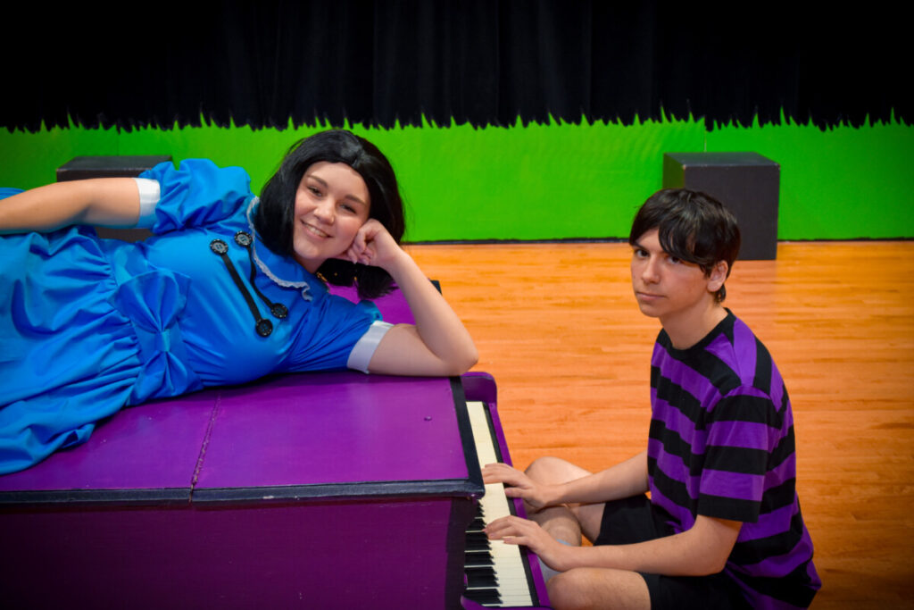 • Lucy (Ella Games) strikes a pose atop Schroeder’s (Jacob Boyette) piano, much to his dismay, in a classic Peanuts moment.