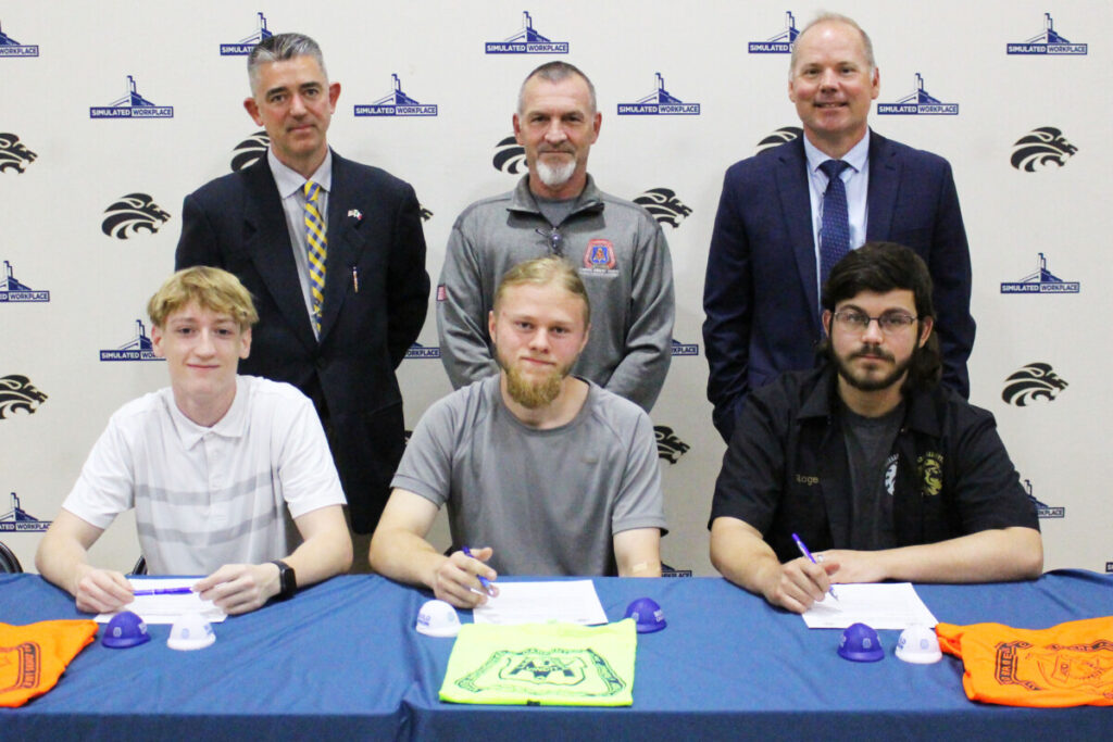 Seated, from left, are Landen Nelson, Jude Kesner-Rankin and Joseph Rogers, the students who signed a letter of intent. Standing, from left, JMHS Carpentry teacher Matthew Ali, Carpenters Regional Council representative Jody Bonfini and JMHS Head Principal Jason Marling.