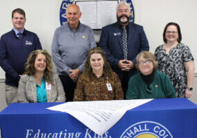 Pictured from left front row: MCS Assistant Superintendent Karen Klamut, MCS Superintendent Dr. Shelby Haines and MCS BOE Vice-President Christie Robison. Back row from left: Marshall County AFT President Josh Gary, Marshall County Commission President Mike Ferro, MC Chamber Executive Director Scott Reager and MCEA President Stephanie Brown.